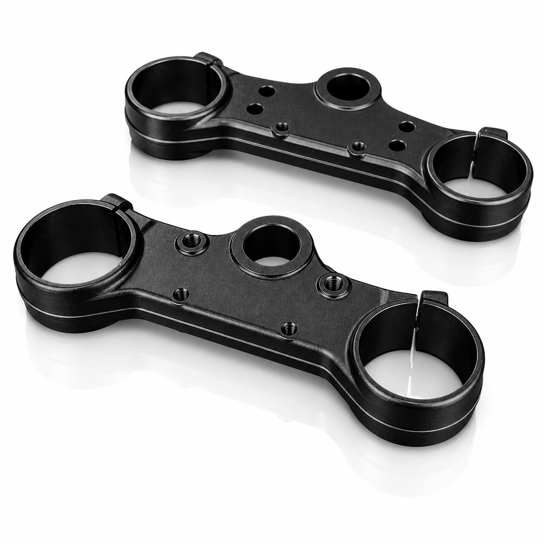 Two black metal brackets on a white background