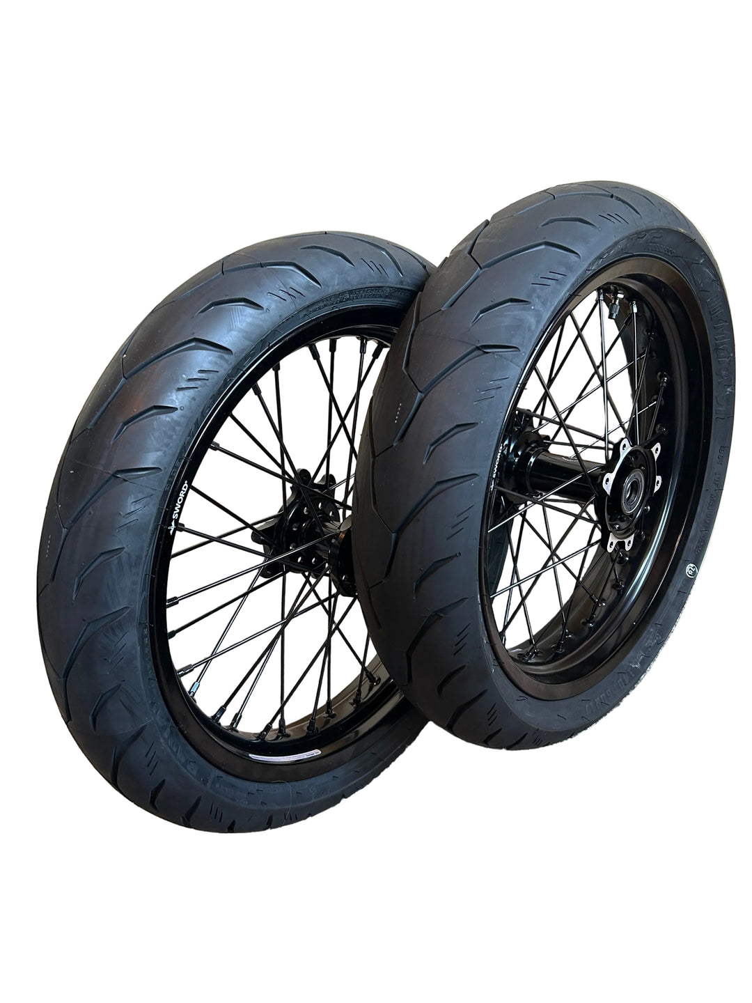 Two motorcycle wheels with black tires on a white background