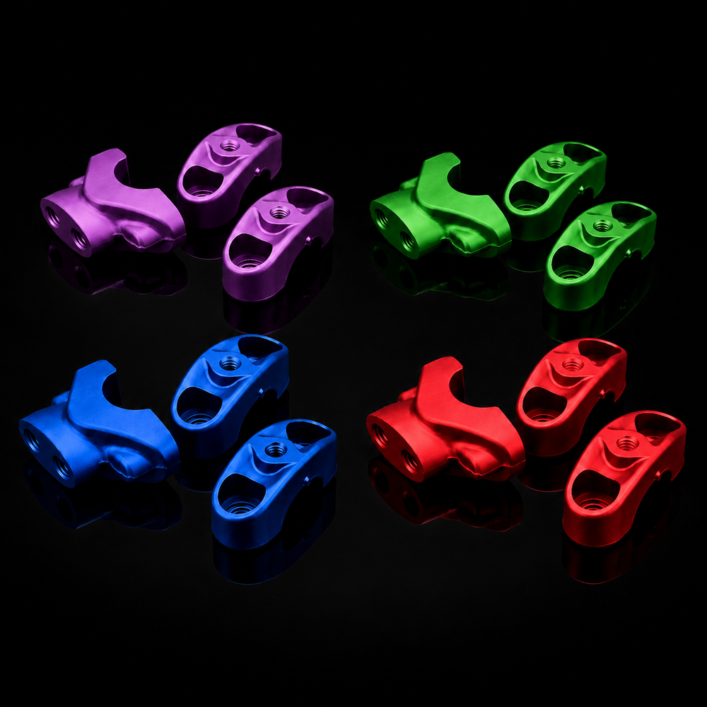 Colorful metal clamps in purple, green, blue, and red on a black background