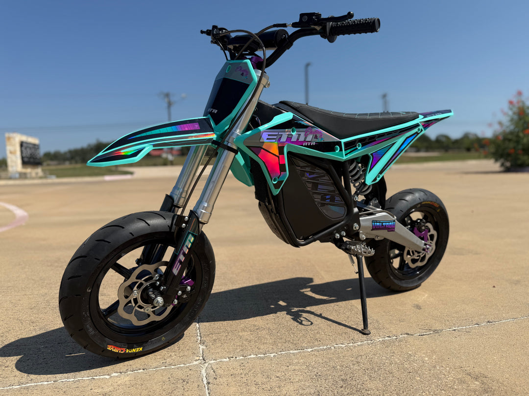 Colorful electric bike on a concrete surface with a clear sky background