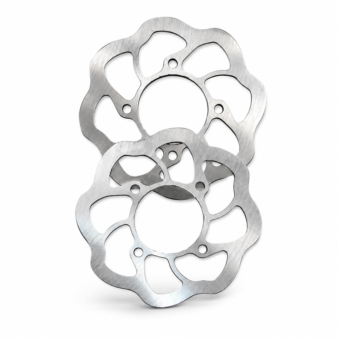 Two brushed metal circular cutout discs with scalloped edges, stacked slightly offset on a clean white background.