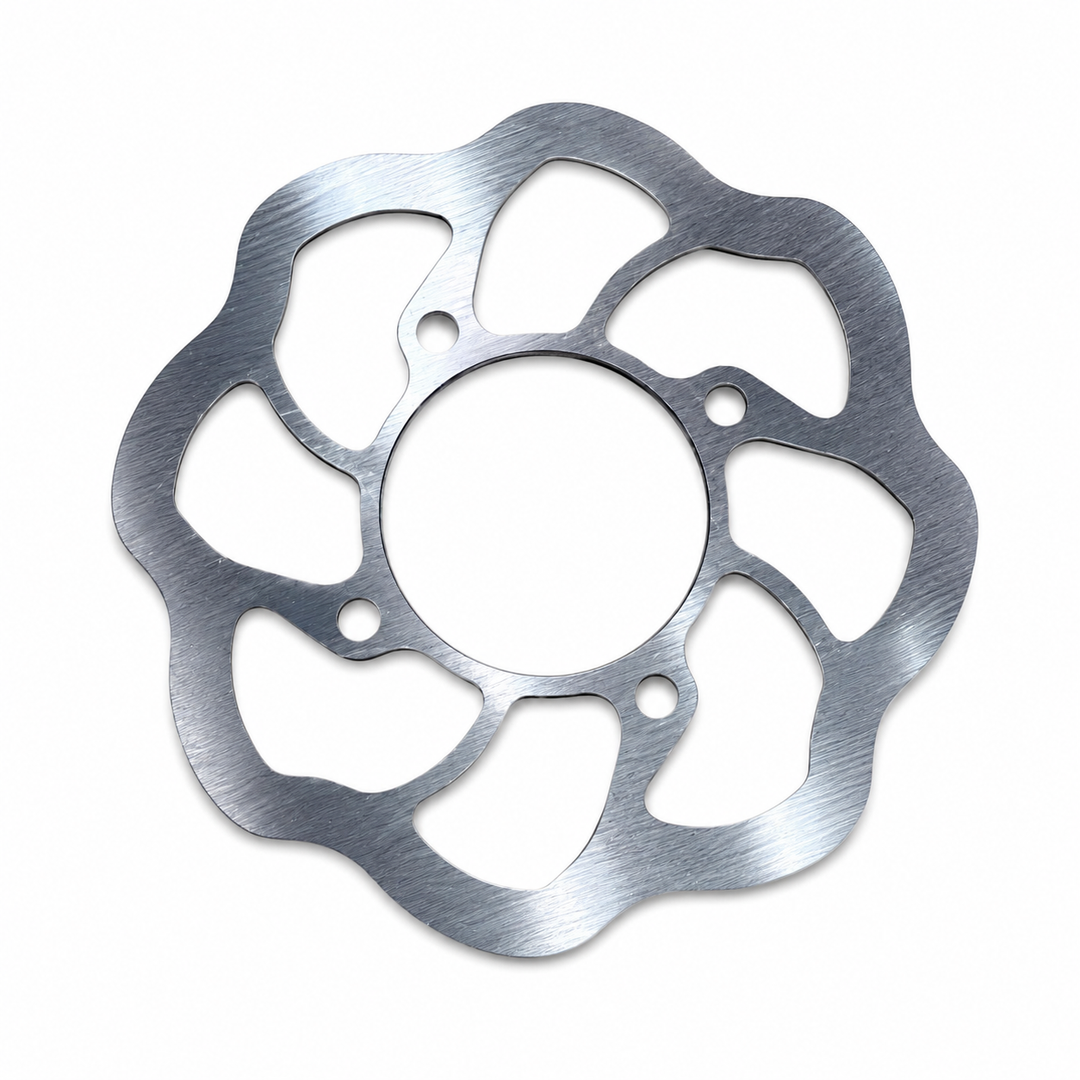 A circular metallic disc brake rotor with a scalloped outer edge and multiple cutouts, shown on a plain white background.