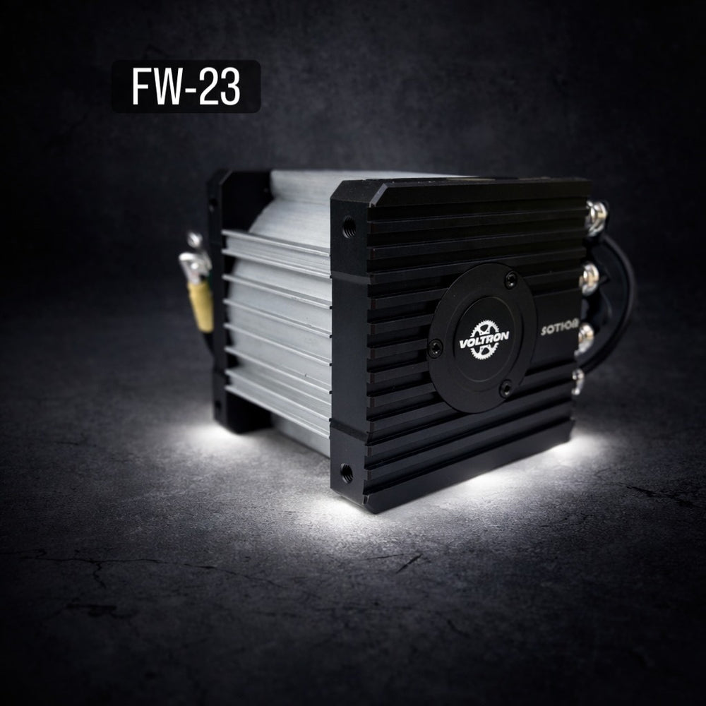 Black and silver electronic device with 'FW-23' label on a dark background