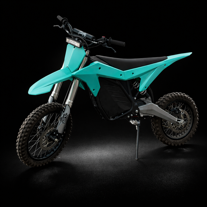 Turquoise electric dirt bike on a black background
