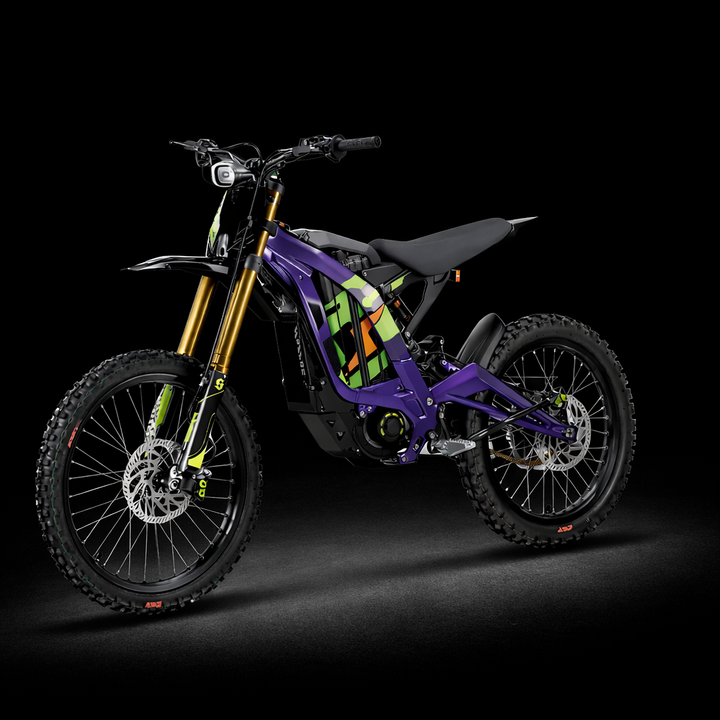 Purple electric bike with colorful accents on a black background