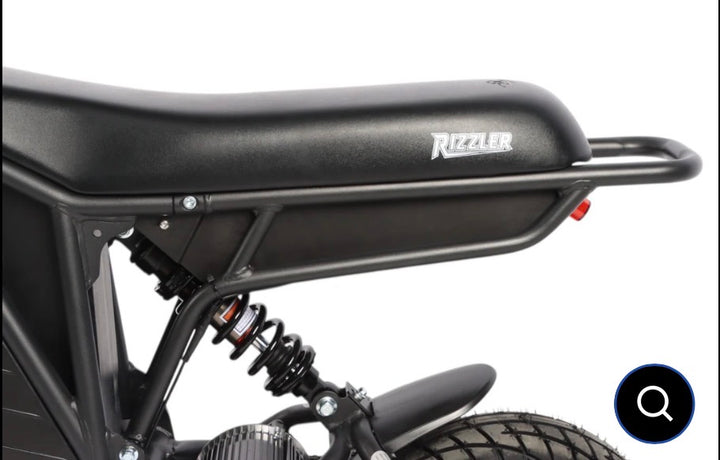 Black motorcycle with 'Rizzler' branding on a white background