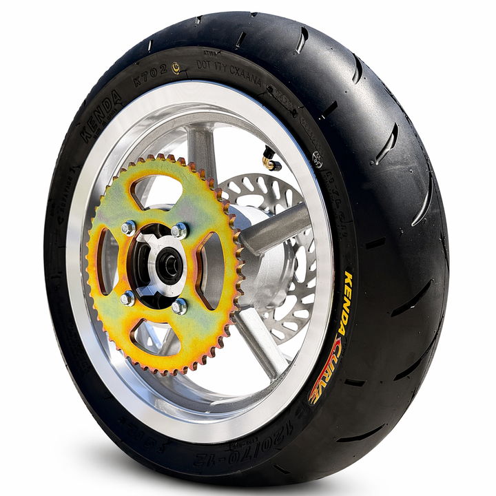 Motorcycle wheel with black tire and yellow gear on a white background