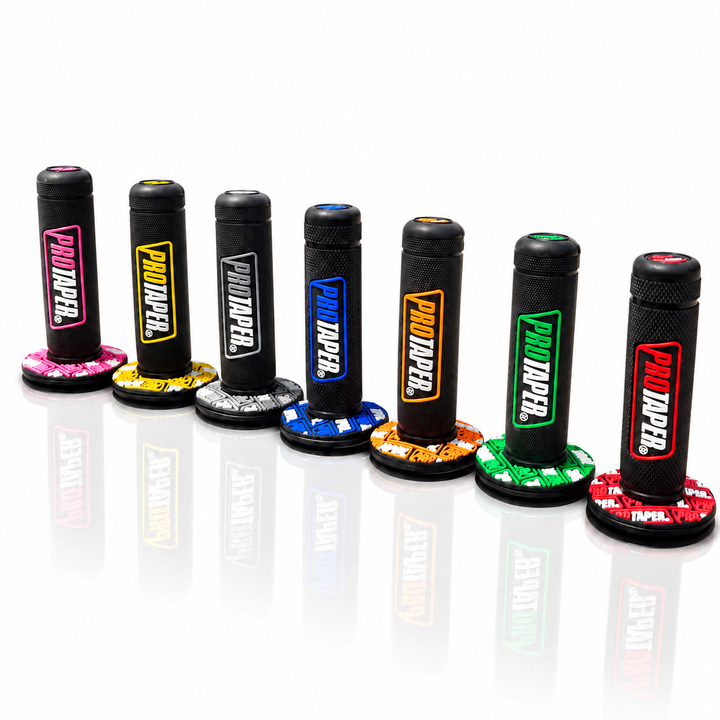 Six PUMPJER motorcycle handlebar grips in different color combinations, arranged in a row on a reflective white surface.