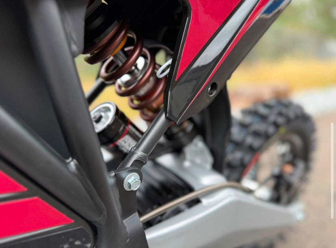 Close-up of a motorcycle suspension system with a blurred background