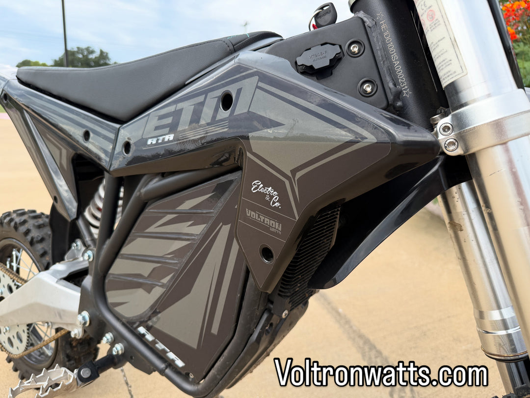 Close-up of a motorcycle with 'ETN' branding on a blurred background