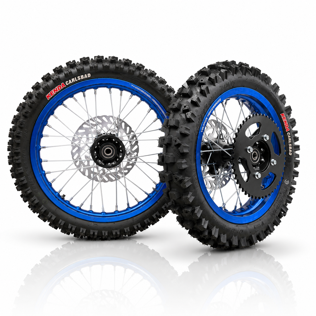 Two off-road motorcycle wheels with knobby tires, blue rims, and disc brakes, displayed on a reflective white background.