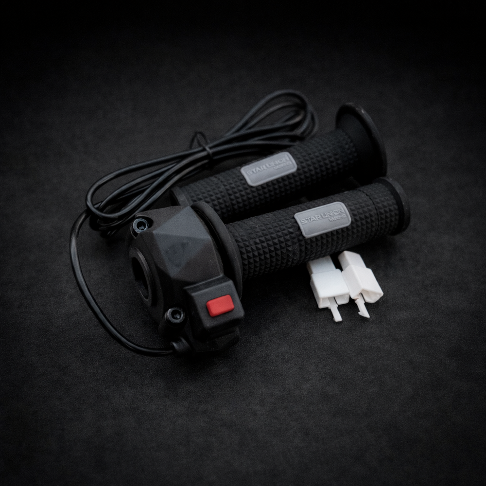 Black electric scooter handlebar controls with wiring on a dark background