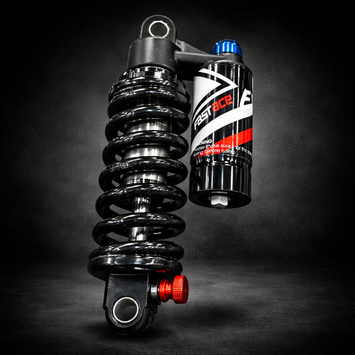 Motorcycle shock absorber with a branded canister on a dark background