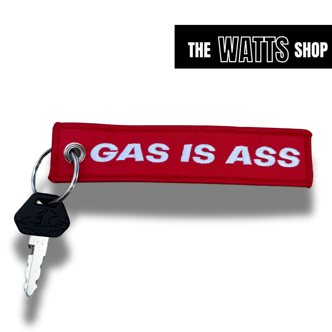 red key chain with white back ground with a ETM RTR key