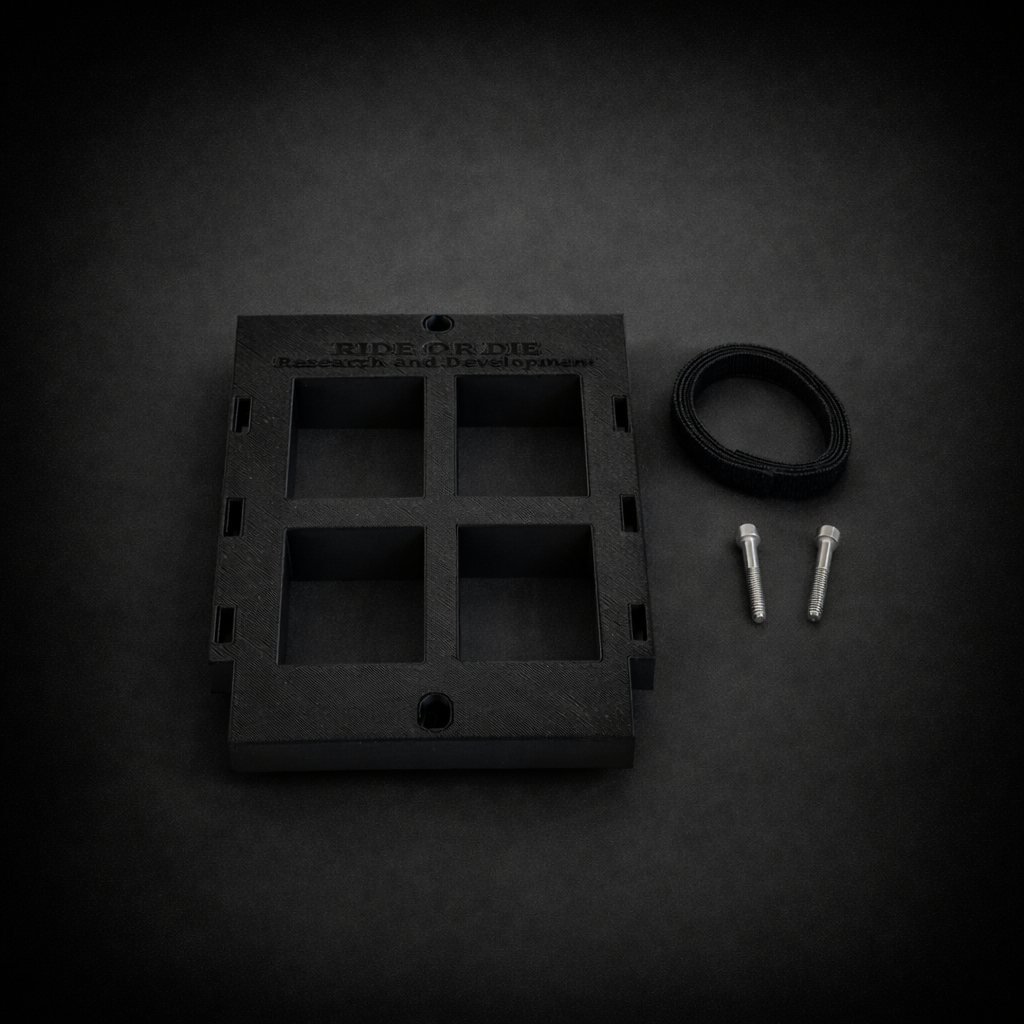 Black metal bracket with mounting hardware on a dark background