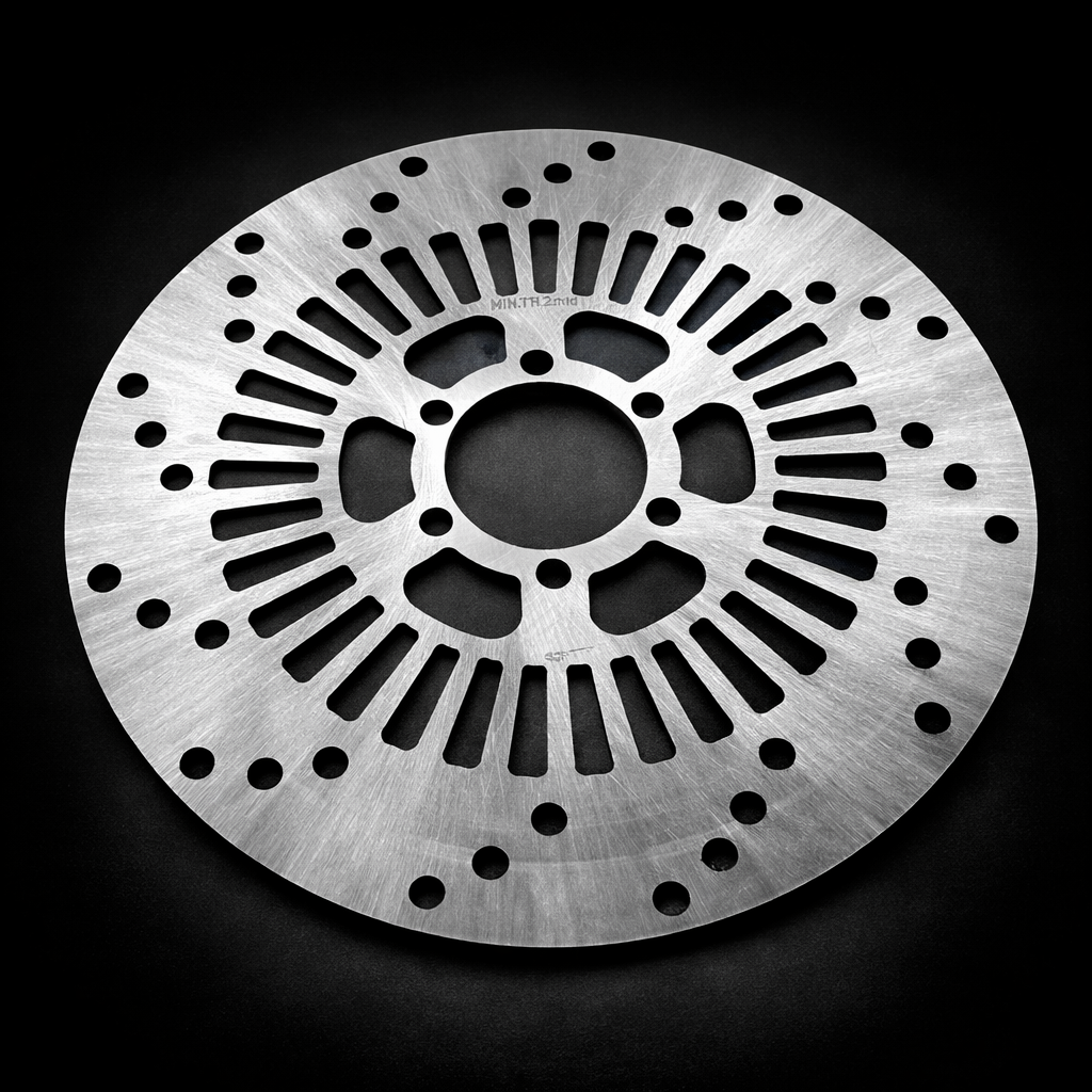 Metallic disc with a textured surface on a black background
